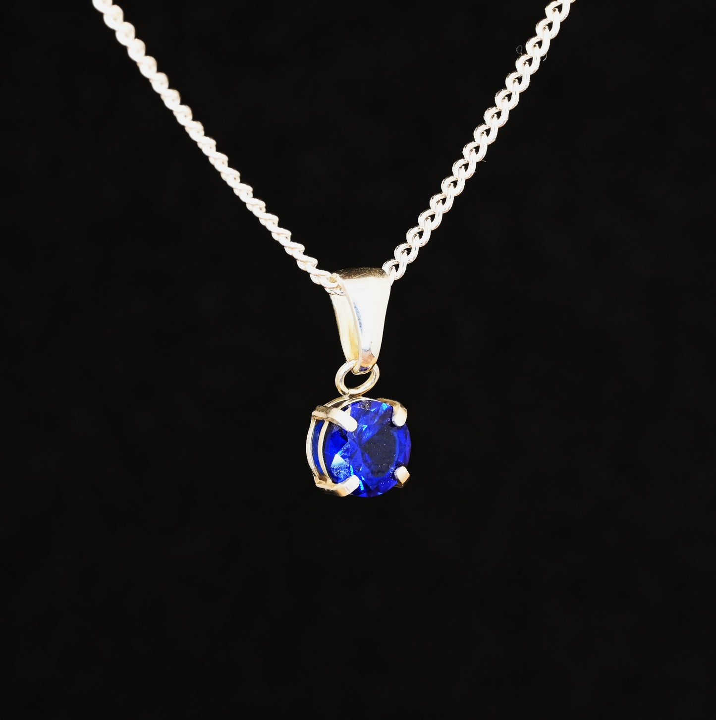 Blue spinel gem set in a sterling silver pendant