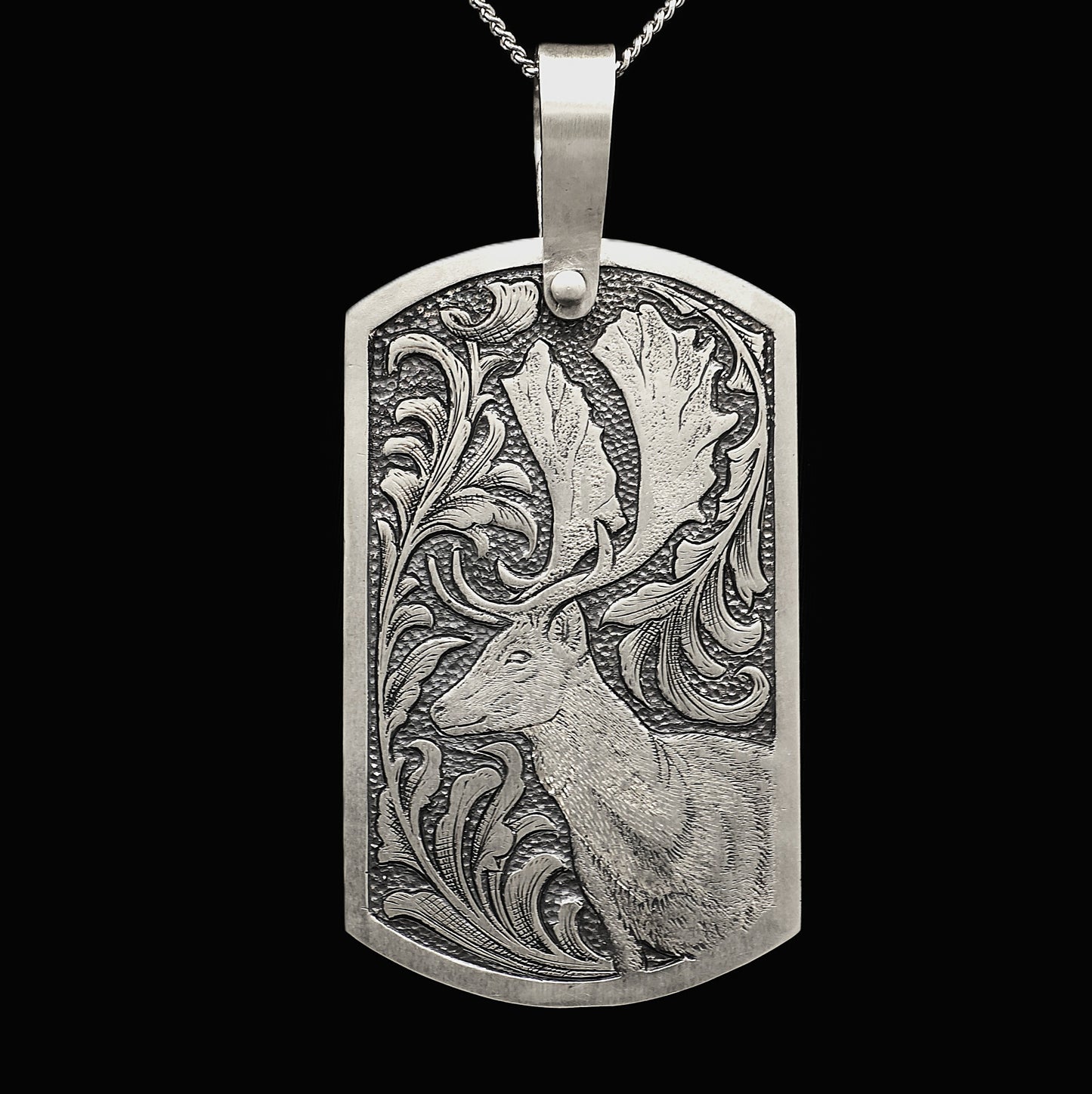 Hand engraved sterling silver pendant with deer and acanthus leaf design