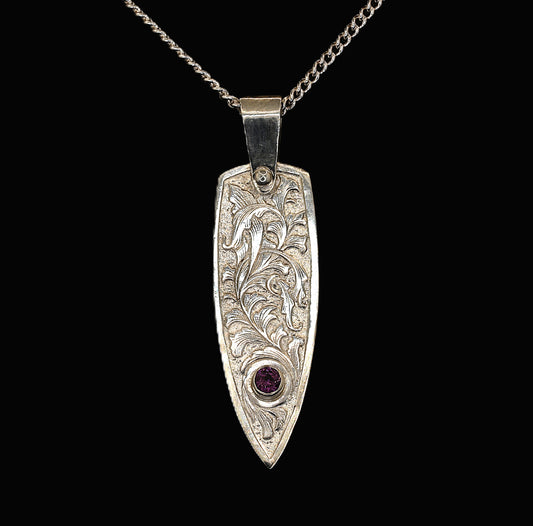 Sterling silver pendant with hand-engraved acanthus leaf design and rhodolite garnet