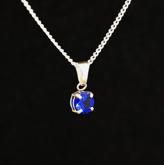 Blue spinel gem set in a sterling silver pendant