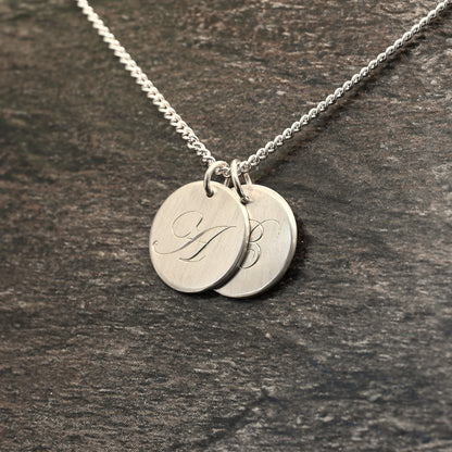 Hand-engraved initial pendant in sterling silver