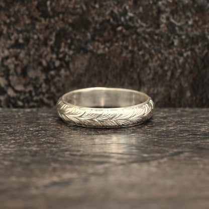 Sterling silver ring with hand‑engraved Germanic wheat design