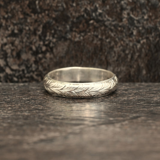 Sterling silver ring with hand‑engraved Germanic wheat design