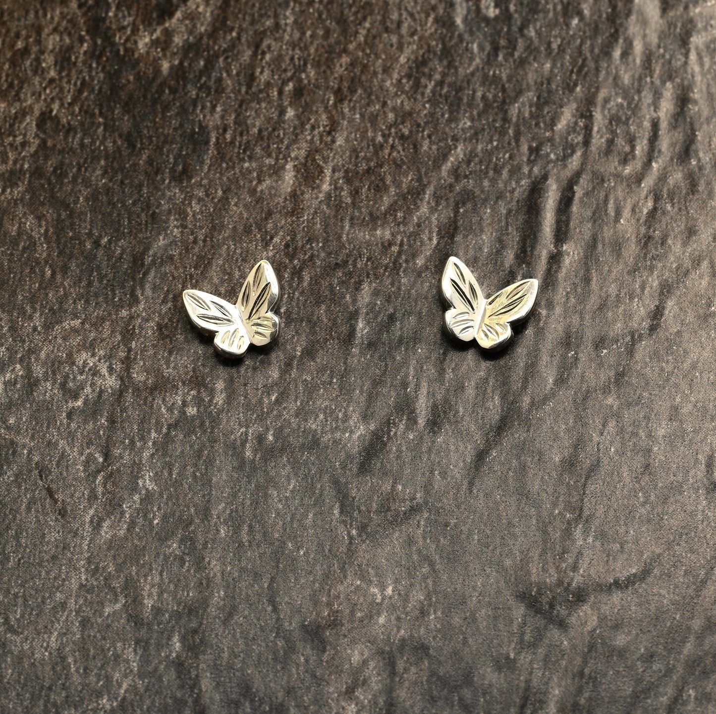Sterling silver butterfly earrings with hand‑engraved wing detailing
