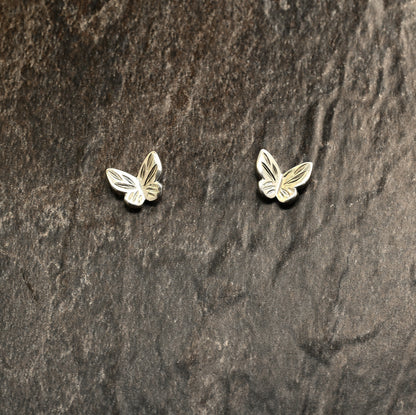 Sterling silver butterfly earrings with hand‑engraved wing detailing