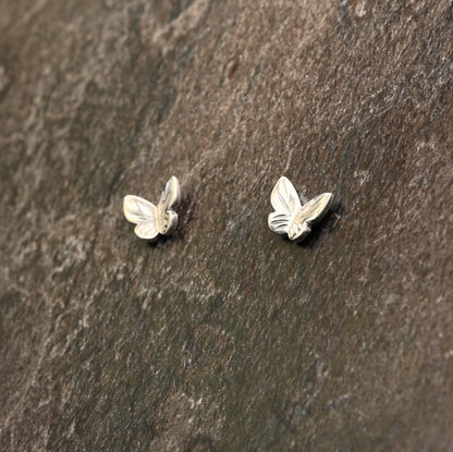 Sterling silver butterfly earrings with hand‑engraved wing detailing