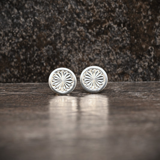 Sterling silver stud earrings with hand‑engraved pattern
